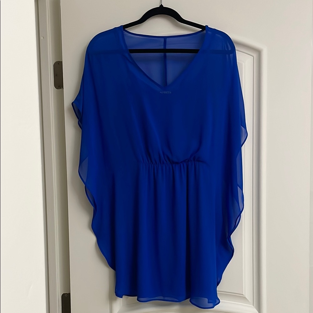 Women's dress. The top layer chiffon and spaghetti strips liner is polyester.